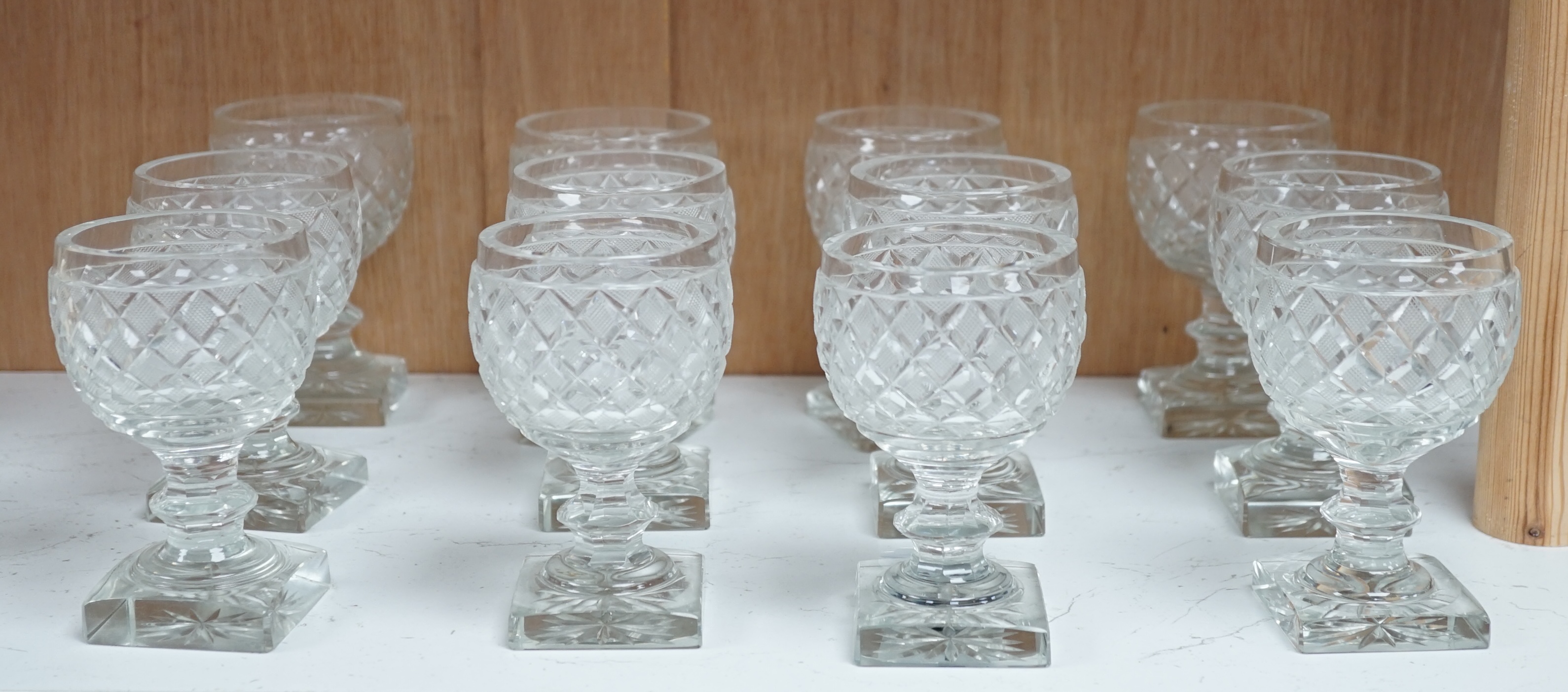 A set of twelve Voneche glass square based wine glasses, 12cm high